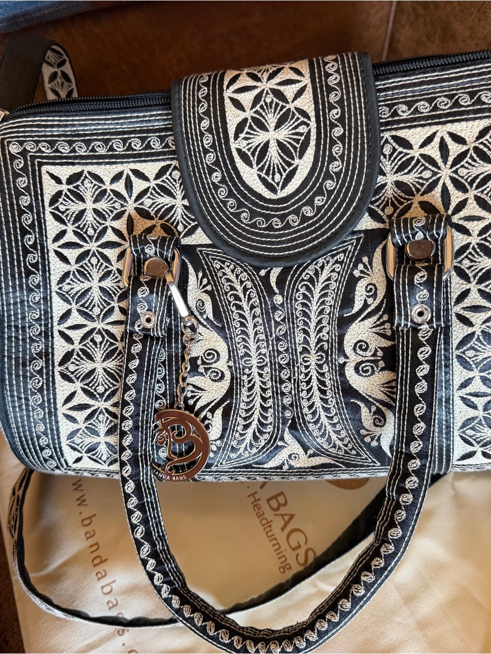Black and Silver Embroidered Barrel Bag with Decorative Charm